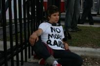 Protester at June Demonstration Outside CCA's Houston Processing Center